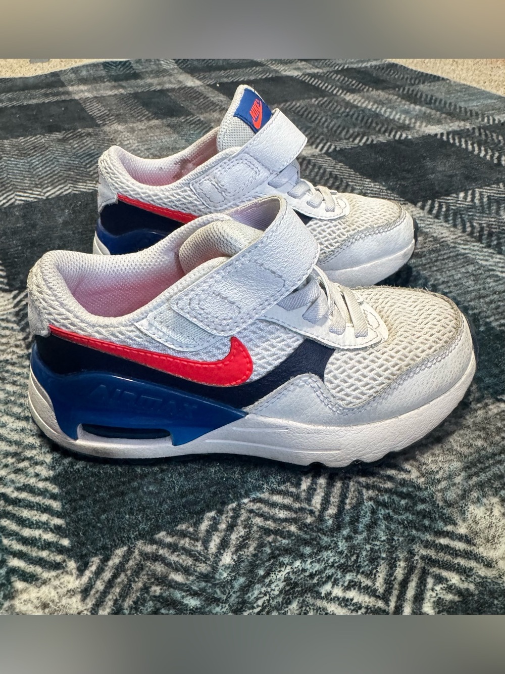 Nike Air Kids White with bright orangish/red Swoosh and Blue Accents